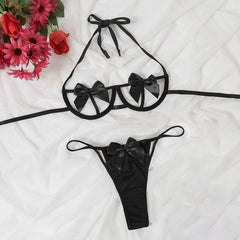 Indulge in sensual play with our Naughty Bow Lingerie Set. This set, available in mysterious black and sexy red, features a Halter Strappy Bra and Cut Out Thong adorned with a bow front design. Ideal for roleplay and gifting, elevate your intimate moments with this cool and stylish women's underwear set.