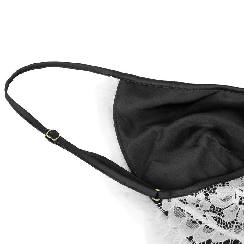 An lace nightgown with an open back design and adjustable straps. The delicate lace detailing and babydoll style provide a feminine and seductive look, while the soft and lightweight fabric ensures comfort and a flattering fit for every body type.