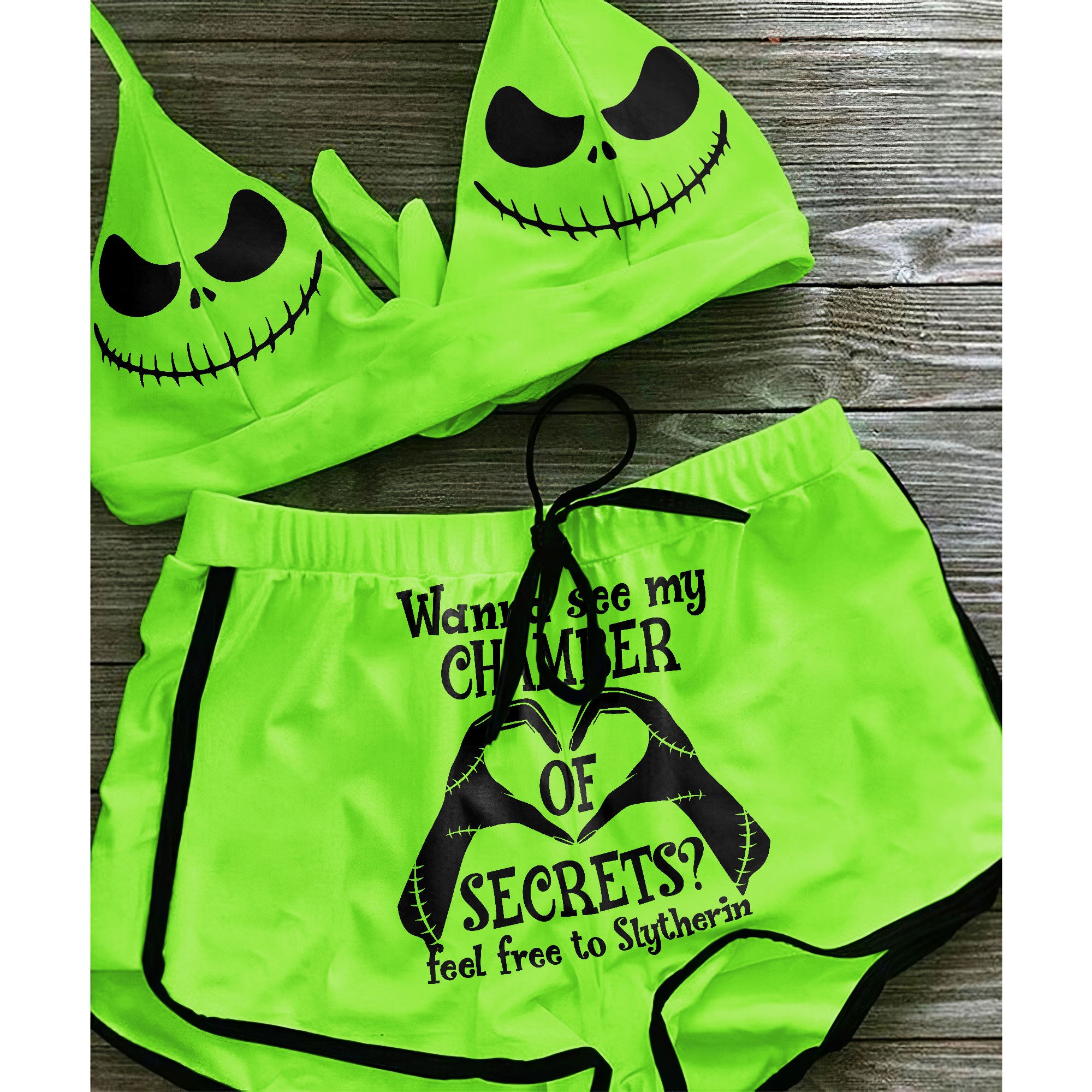 A sexy green two-piece string bikini for women, perfect for making a statement on the beach. The bikini features a halter V-neck, adjustable spaghetti straps, and removable soft padded cups for a flattering fit. Playful quote and Nightmare Before Christmas characters add a unique touch to this swimsuit. Stand out and have fun in this one-of-a-kind bathing suit.