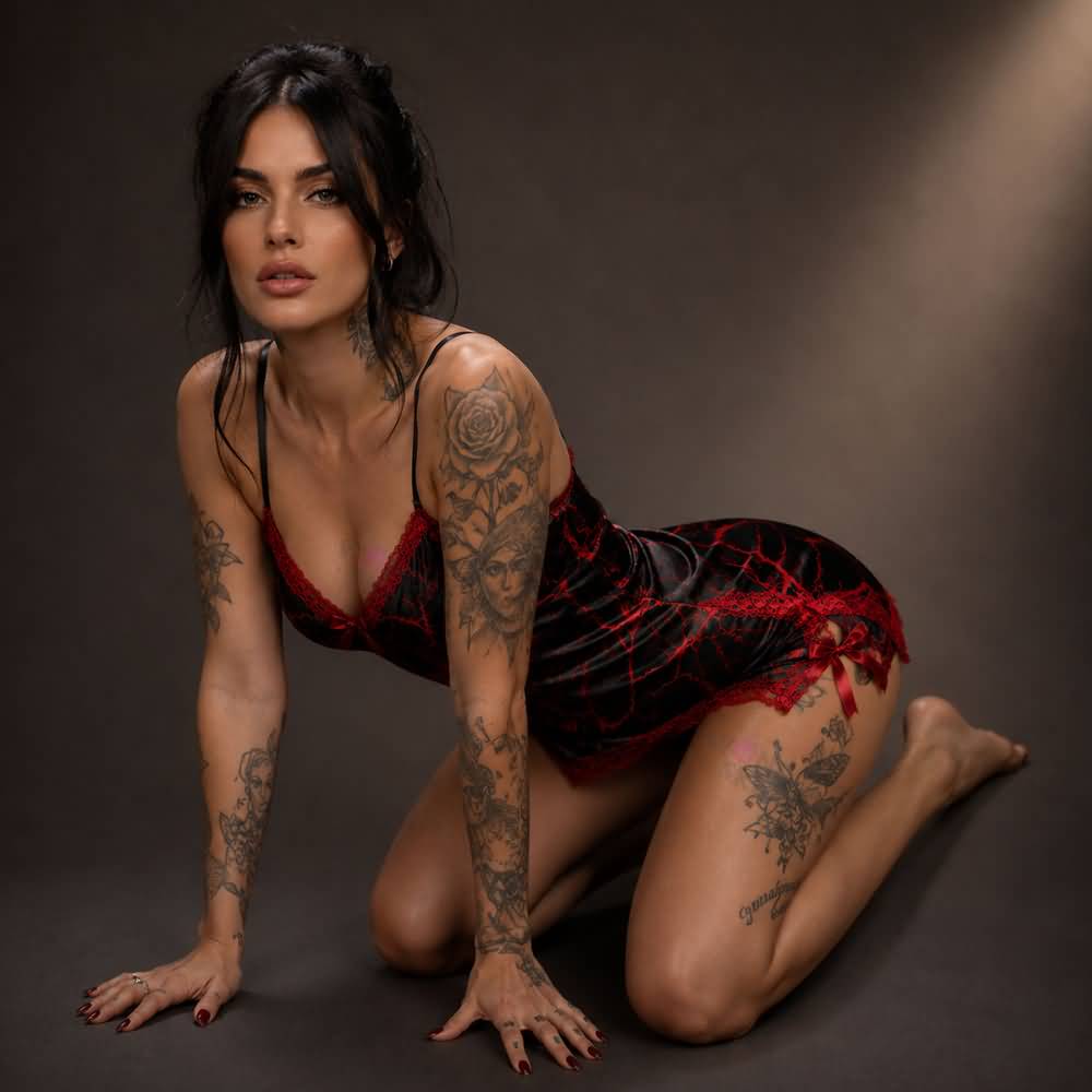 Experience better sleep with the Wonder Skull Chemise Nightgown. Its buttery-soft satin feels amazing, while red lace panels at the neckline, sides, and hem keep you cool all night. The adjustable straps and flowing A-line silhouette allow for a comfortable, non-restrictive fit. Bold red crackle skeleton artwork is balanced by sweet satin bows, adding a feminine touch.