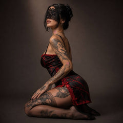 Experience better sleep with the Wonder Skull Chemise Nightgown. Its buttery-soft satin feels amazing, while red lace panels at the neckline, sides, and hem keep you cool all night. The adjustable straps and flowing A-line silhouette allow for a comfortable, non-restrictive fit. Bold red crackle skeleton artwork is balanced by sweet satin bows, adding a feminine touch.