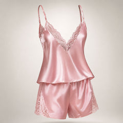 Upgrade your sleepwear with the Wonder Skull Dusty Pink Satin Lace Pajama Set. This two-piece set is made from a buttery-soft satin that feels amazing against your skin and is trimmed with delicate eyelash lace for a romantic touch. The V-back design keeps you cool, while adjustable spaghetti straps ensure a perfect fit. This matching set will make you feel beautiful, whether you're sleeping soundly or enjoying a lazy morning.