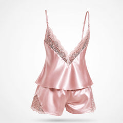 Upgrade your sleepwear with the Wonder Skull Dusty Pink Satin Lace Pajama Set. This two-piece set is made from a buttery-soft satin that feels amazing against your skin and is trimmed with delicate eyelash lace for a romantic touch. The V-back design keeps you cool, while adjustable spaghetti straps ensure a perfect fit. This matching set will make you feel beautiful, whether you're sleeping soundly or enjoying a lazy morning.