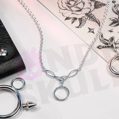 Wonder Skull A dainty stainless steel cable chain leads into an elegant Celtic-style twist link cradling a single polished O-ring — the timeless symbol of D/s devotion. Light, waterproof, and tarnish-resistant, it's built for true 24/7 wear yet discreet enough to pass as everyday jewelry. Unmistakable to the one who knows, invisible to everyone else.