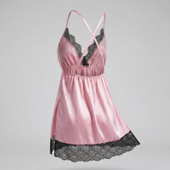Make your nighttime routine beautiful with the Wonder Skull Pink Black Lace Chemise. Its buttery-smooth satin glides against your skin, and the elastic cinched waist flatters your shape. Adjustable criss-cross back straps stay in place and customize the fit. Delicate, soft scalloped eyelash lace adds a romantic contrast at the neckline and hem. Plus, side slits allow for easy movement, so you can wake up comfortable and tangle-free.
