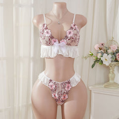 Wonder Skull Pink Floral Lace Embroidered Ruffle Bralette and Panty Set offers a feminine look without uncomfortable squeezing or digging. Its wire-free, soft cup design and breathable mesh fabric allow for natural movement while keeping you cool. The smooth floral embroidery adds a touch of romance without causing irritation. Adjustable straps and a hook-and-eye closure ensure a custom, secure fit. Finished with sweet white ruffle trim and satin bows, this set is designed to make you feel both beautiful an