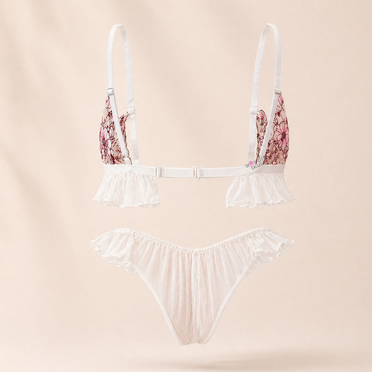 Wonder Skull Pink Floral Lace Embroidered Ruffle Bralette and Panty Set offers a feminine look without uncomfortable squeezing or digging. Its wire-free, soft cup design and breathable mesh fabric allow for natural movement while keeping you cool. The smooth floral embroidery adds a touch of romance without causing irritation. Adjustable straps and a hook-and-eye closure ensure a custom, secure fit. Finished with sweet white ruffle trim and satin bows, this set is designed to make you feel both beautiful an