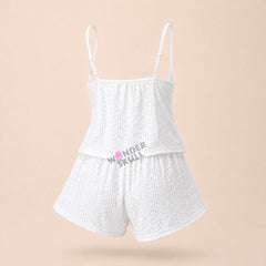 Stay cool and comfortable all night with the Wonder Skull Pajama Set. The breathable, embroidered fabric allows for constant airflow to prevent overheating, while the soft, scalloped lace trim adds a romantic detail without irritation. Customize your fit with the adjustable tie-front closure and a comfortable elastic waistband. The lightweight fabric helps you sleep peacefully and wake up refreshed.