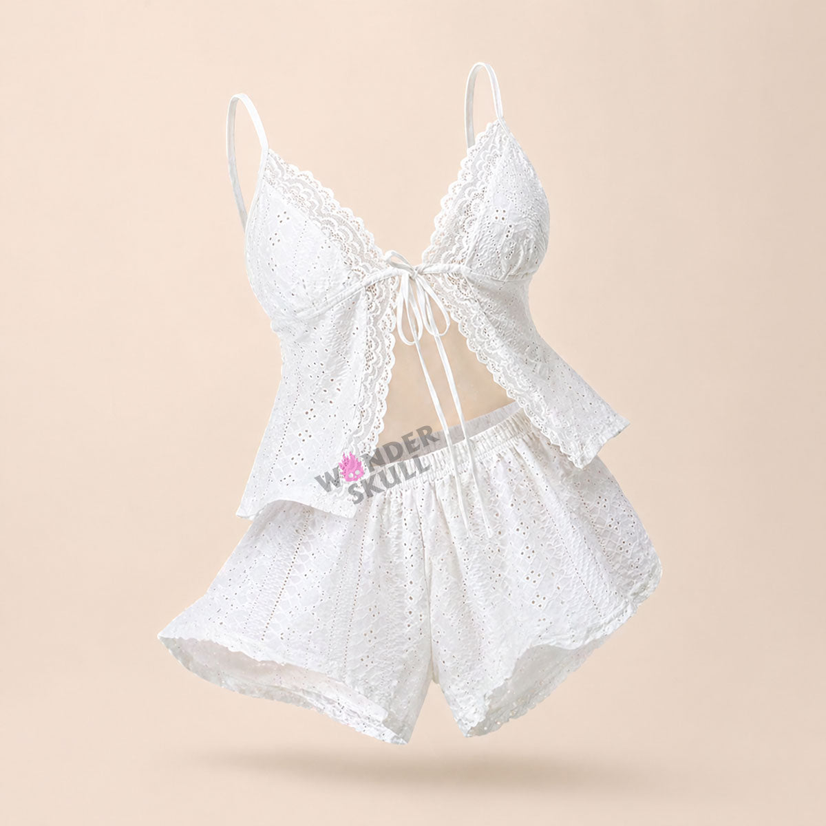 Stay cool and comfortable all night with the Wonder Skull Pajama Set. The breathable, embroidered fabric allows for constant airflow to prevent overheating, while the soft, scalloped lace trim adds a romantic detail without irritation. Customize your fit with the adjustable tie-front closure and a comfortable elastic waistband. The lightweight fabric helps you sleep peacefully and wake up refreshed.
