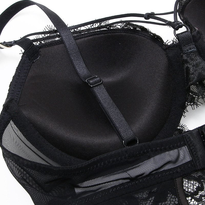 Welcome to the world of allure and elegance with the Nightmare Bandage Women's Bodysuit Sexy Hollow Lace Push Up.