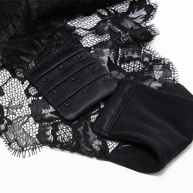 Welcome to the world of allure and elegance with the Nightmare Bandage Women's Bodysuit Sexy Hollow Lace Push Up.