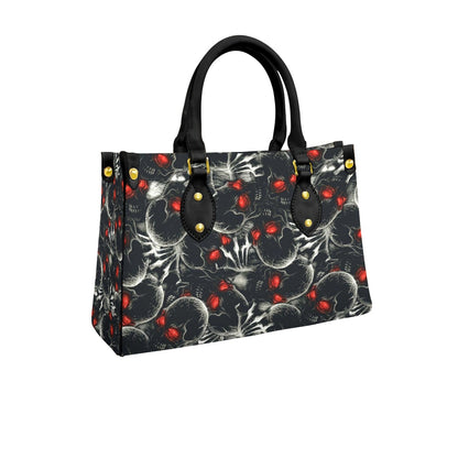 Wonder Skull structured tote bag solves the "I can't find anything in my bag" problem. The aoomy interior fits your tablet, phone, wallet, water bottle, umbrella, and cosmetics — without the overstuffed look. Multiple interior pockets keep everything organized, so you're never digging around at checkout. Reinforced rivet corners and quality metal hardware ensure the bag holds up to daily use. Whether you're heading to work, running errands, or catching a flight, this tote keeps you looking put-together.