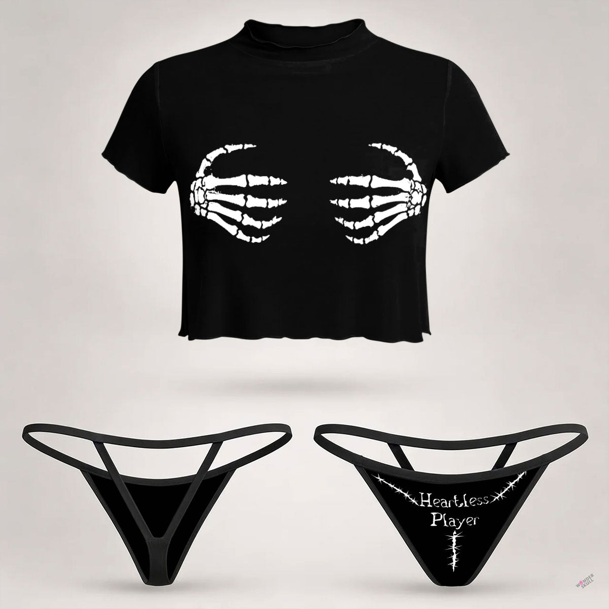 Wonder Skull  sheer mesh crop top and thong set delivers the perfect balance of comfortable and confident. Ultra-lightweight mesh fabric breathes freely against your skin while stretching gently to hug your natural curves without any restrictive squeezing. Playful lettuce edge trim at the neckline, sleeves, and hem adds cute feminine detail with soft ruffled texture. The flattering cropped length hits perfectly above your waist, creating an elongated silhouette that makes you feel amazing. Whether you're we