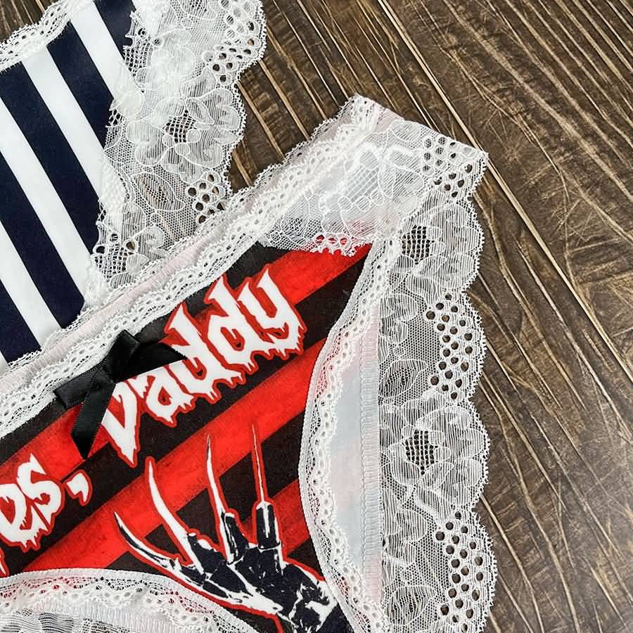 Wonder Skull Sinful Strings Lace Panty Set is for those who love mixing sweet with sassy. The white lace contrasts with bold gothic graphics and cheeky sayings, creating underwear that's both innocent and playful. Designed to make you feel confident and unstoppable, this set is perfect for treating yourself or planning a fun surprise. Comfort and attitude, all in one.