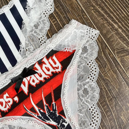 Wonder Skull Sinful Strings Lace Panty Set is for those who love mixing sweet with sassy. The white lace contrasts with bold gothic graphics and cheeky sayings, creating underwear that's both innocent and playful. Designed to make you feel confident and unstoppable, this set is perfect for treating yourself or planning a fun surprise. Comfort and attitude, all in one.
