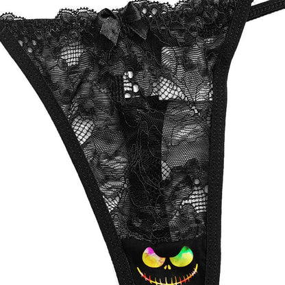 Transform your nighttime routine with the Wonder Skull glow-in-the-dark sleepwear set. The vibrant rainbow skull graphics absorb light by day and glow when darkness falls. Made from a buttery-soft, breathable fabric, this set keeps you cool all night. The delicate, dotted lace trim adds a feminine touch without being scratchy, while adjustable spaghetti straps ensure a perfect fit. This three-piece set includes a matching cami, shorts, and thong, letting you express your bold personality in comfort.