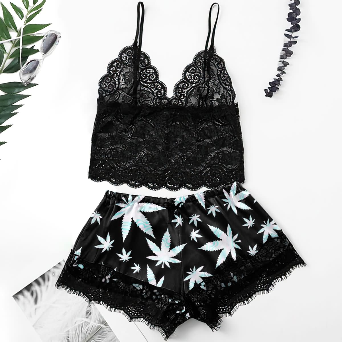 Wonder Skull High Life Lace Trim Pajama Lingerie Sleepwear Shorts Set Upgrade your lounge game with these stylish pajama shorts! Featuring bold leaf prints, flirty lace hems, and a comfortable elastic waistband with adjustable tie, they’re perfect for relaxing or spicing up your evenings. Made with lightweight, breathable fabric and a lace-trimmed back design, these shorts combine comfort, style, and a touch of drama.