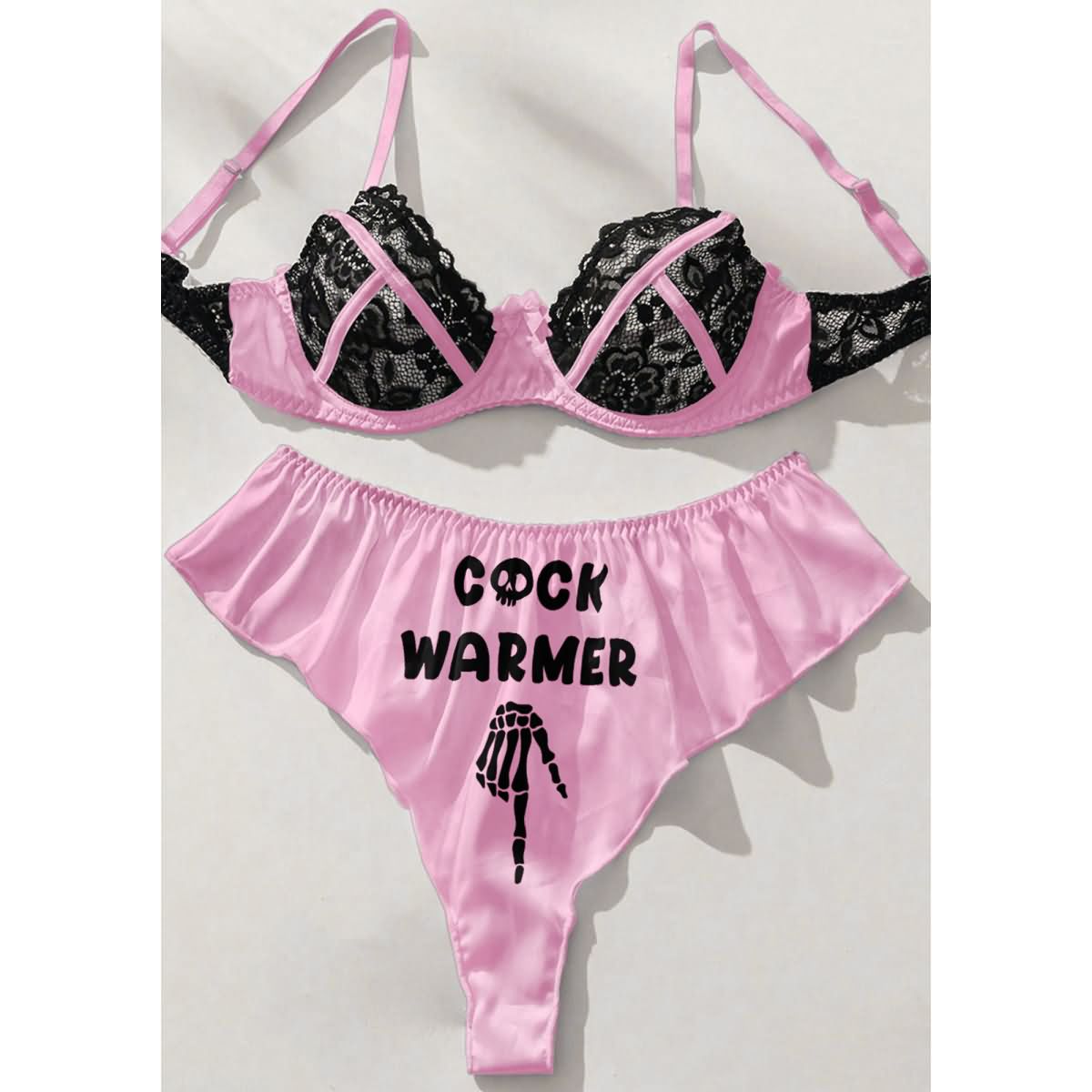 Wonder Skull Contrast Lace Bra and Panty Set combines trendy style with comfort, featuring a playful "Cock Warmer" print and exquisite lace detailing. This lingerie set is designed to elevate your beauty and spice up intimate moments, making it perfect for special occasions or adding excitement to your routine.