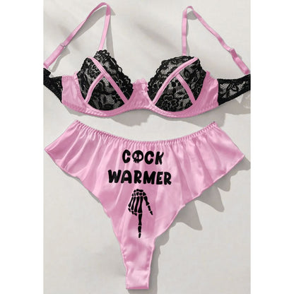 Wonder Skull Contrast Lace Bra and Panty Set combines trendy style with comfort, featuring a playful "Cock Warmer" print and exquisite lace detailing. This lingerie set is designed to elevate your beauty and spice up intimate moments, making it perfect for special occasions or adding excitement to your routine.