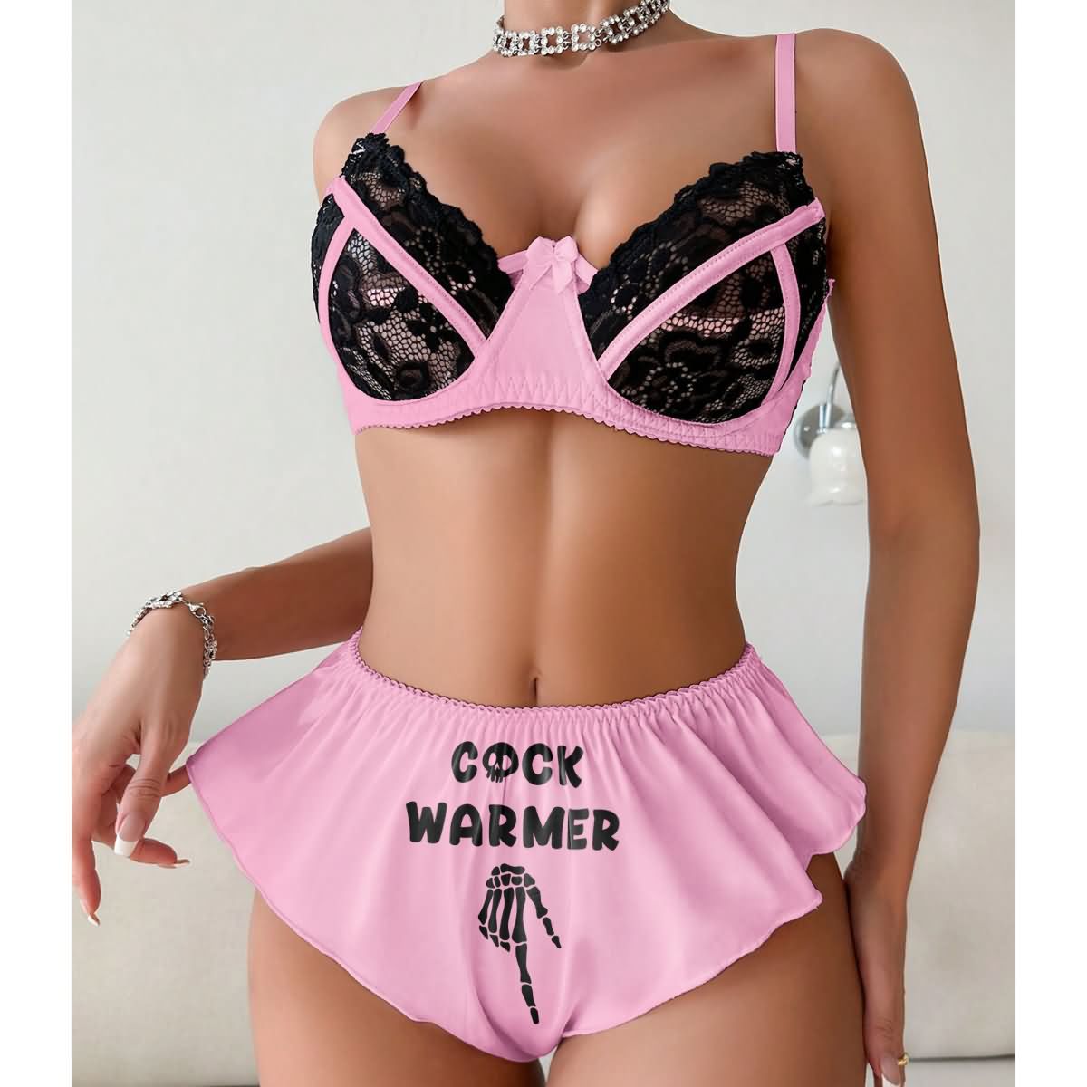 Wonder Skull Contrast Lace Bra and Panty Set combines trendy style with comfort, featuring a playful "Cock Warmer" print and exquisite lace detailing. This lingerie set is designed to elevate your beauty and spice up intimate moments, making it perfect for special occasions or adding excitement to your routine.