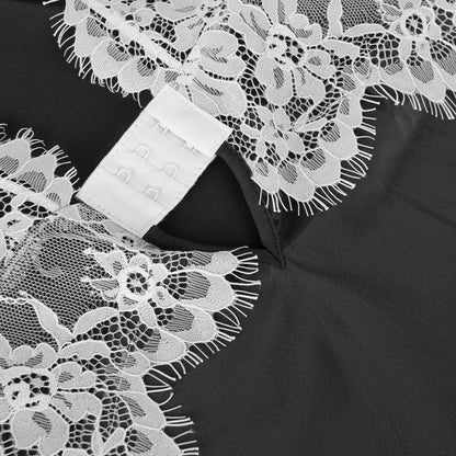 An lace nightgown with an open back design and adjustable straps. The delicate lace detailing and babydoll style provide a feminine and seductive look, while the soft and lightweight fabric ensures comfort and a flattering fit for every body type.