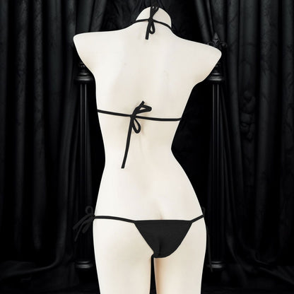 An alluring and seductive lingerie set with a gothic style, featuring intricate details and a unique print that makes it perfect for Halloween or any daring occasion. The set includes a top and bottom, both designed to fit perfectly and enhance the wearer's curves, making her feel confident and empowered.