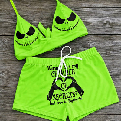 Wonder Skull sexy green two-piece string bikini for women, perfect for making a statement on the beach. The bikini features a halter V-neck, adjustable spaghetti straps, and removable soft padded cups for a flattering fit. Playful quote and Nightmare Before Christmas characters add a unique touch to this swimsuit. Stand out and have fun in this one-of-a-kind bathing suit.