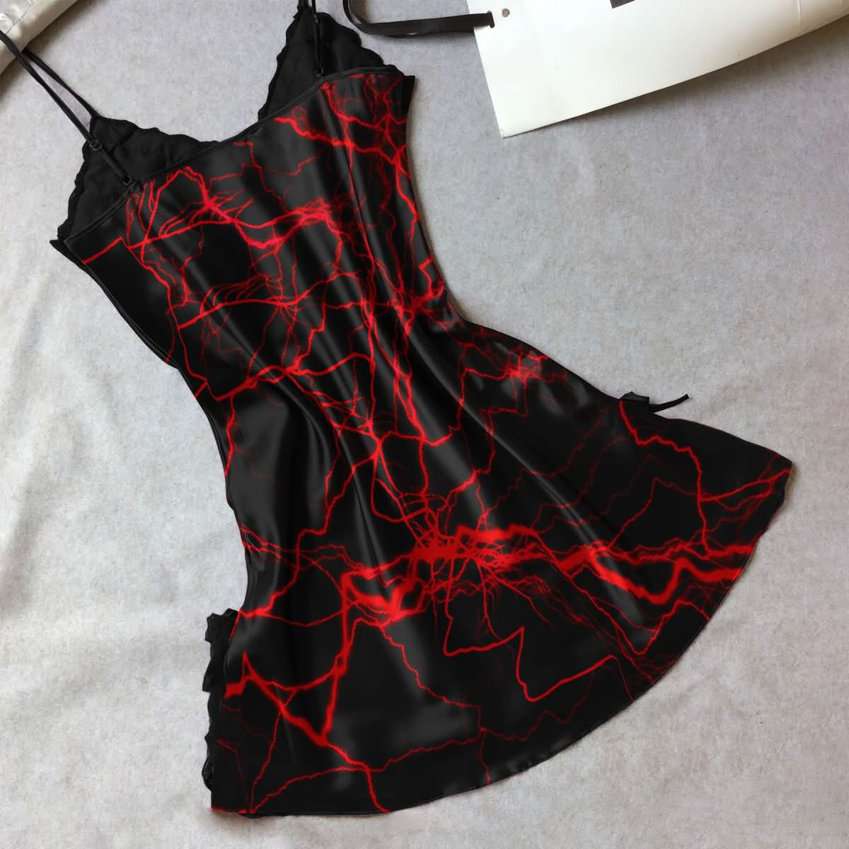 Women's Red Lace Nightgown, Sexy Spaghetti Strap Babydoll Nightwear Chemise. Indulge in luxurious comfort and stunning style with this red lace chemise featuring a slim fit design and plunging V-neckline. Inspired by 'Little Nightmare Before Xmas', this nightgown combines gothic symbols with red lace for a captivating look. Perfect for a romantic evening, the dual side slits add a touch of sexiness to this beautiful piece.