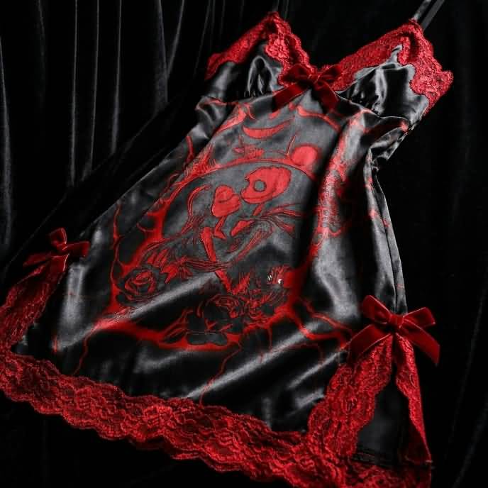 Experience better sleep with the Wonder Skull Chemise Nightgown. Its buttery-soft satin feels amazing, while red lace panels at the neckline, sides, and hem keep you cool all night. The adjustable straps and flowing A-line silhouette allow for a comfortable, non-restrictive fit. Bold red crackle skeleton artwork is balanced by sweet satin bows, adding a feminine touch. 