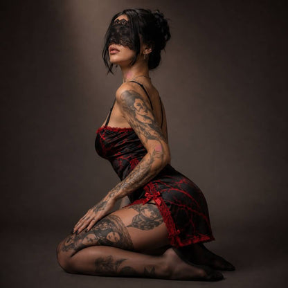 Experience better sleep with the Wonder Skull Chemise Nightgown. Its buttery-soft satin feels amazing, while red lace panels at the neckline, sides, and hem keep you cool all night. The adjustable straps and flowing A-line silhouette allow for a comfortable, non-restrictive fit. Bold red crackle skeleton artwork is balanced by sweet satin bows, adding a feminine touch. 