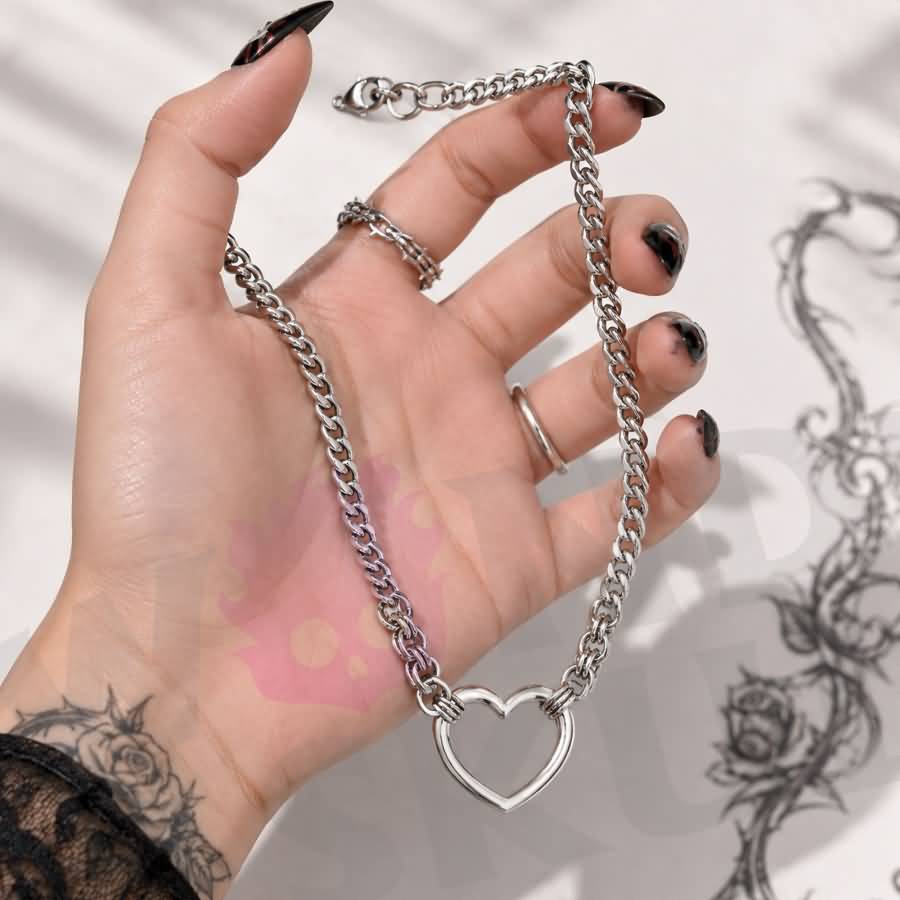 Wonder Skull Chunky Cuban Heart Day Chain features a bold stainless steel Cuban chain with a 3.2 × 3 cm open-heart centerpiece. Available in 16" or 18" lengths, it's tarnish- and rust-resistant for a lasting polished look. A lobster clasp finish blends statement style with the subtle symbolism of a D/s connection. Wear the bond. Let them wonder.