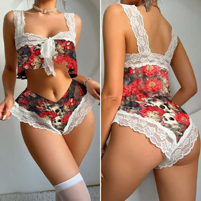 Wonder Skull Crimson Bloom Skull Lace Lingerie Comfort Sleepwear Pajama Set set blends soft white lace and romantic red floral prints with bold skull art for a unique mix of sweet and edgy. Featuring a flattering high-waisted fit, wrap top, and cheeky bottoms, it’s designed for comfort and confidence. Perfect for cozy nights or embracing your inner rebel, this versatile set adds attitude to any vibe.