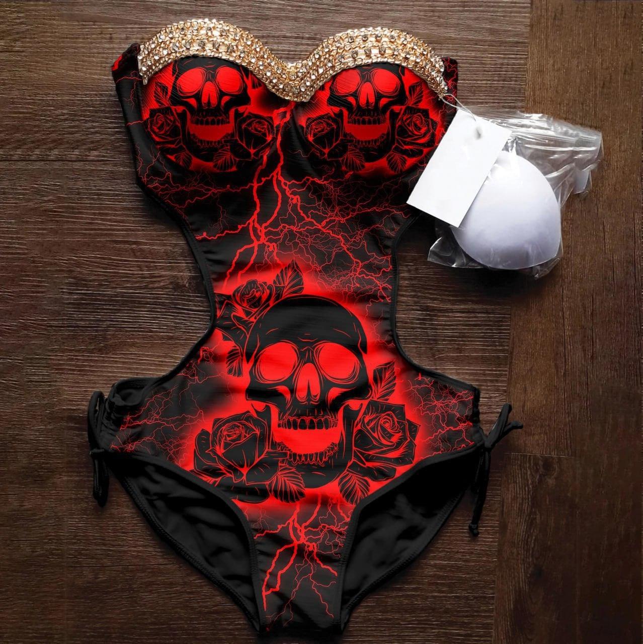 Wonder Skull Cut Out Bikini Red Skull One Pice Swimsuit features a striking red skull and rose design with lightning details, accented by subtle gold crystals for added style. Its tummy control fit and adjustable straps offer comfort and confidence, while the high-quality stretch fabric ensures durability and flexibility. Perfect for days by the water or relaxing with loved ones, this swimsuit combines individuality, comfort, and support.