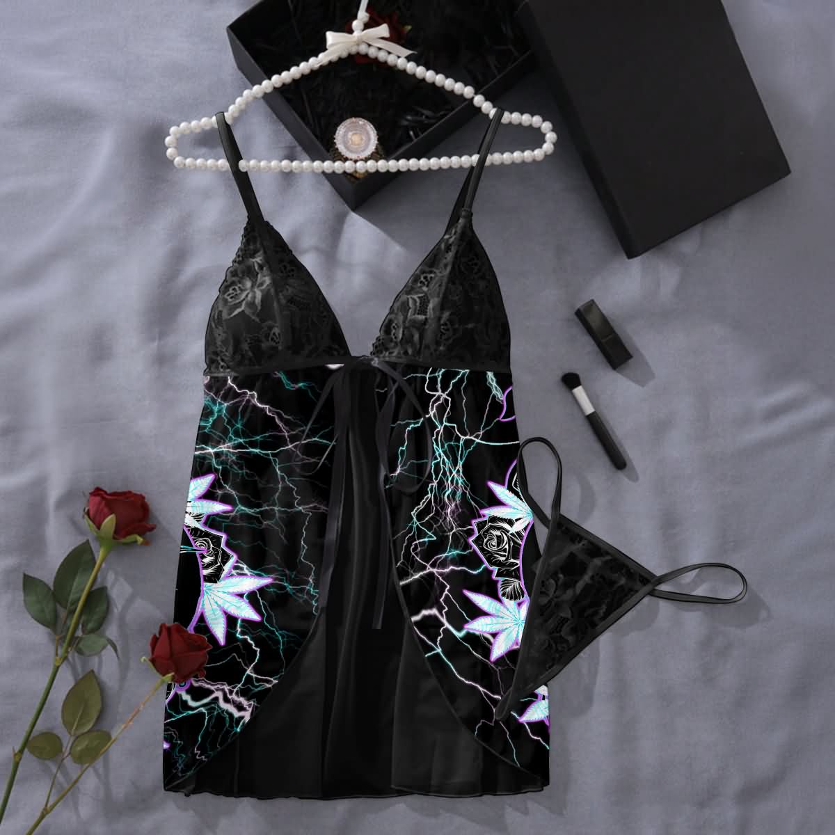 Wonder Skull Electric Love Gothic Lace Nightgown Babydoll Sleepwear Set blends delicate lace with bold neon lightning accents for an edgy, seductive look. Featuring a romantic back design with rose and leaf details, a flirty tie-front closure, and a matching lace thong, it’s perfect for making a daring statement.