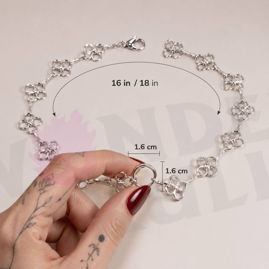 Wonder Skull Flower Link O-Ring Day Collar A quiet promise of devotion. This day collar features delicate stainless steel blossoms meeting at a polished 1.6 cm O-ring. Waterproof, tarnish-resistant, and built for 24/7 wear, it is available in 16" or 18" lengths. It is subtle enough to pass as everyday jewelry, yet unmistakable to those in the know. Pretty on the surface, unbreakable underneath.