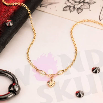 Wonder Skull Gold Heart Charm Day Collar Stainless Steel Sub Necklace. A quiet promise for everyday wear. A dainty gold-tone chain connects a Celtic-style twist to a puffed heart charm—a discreet symbol only the two of you understand. Built for 24/7 wear, it's waterproof, tarnish-free, and hypoallergenic. Available in 16" or 18", it looks like everyday jewelry but means too much to ever take off. Devotion you wear. Strength you keep.