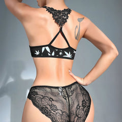Wonder Skull High on Desire Lace Lingerie Set features a bold leaf print, sheer floral lace, and a strappy racerback with a front-clip clasp for style and convenience. Made from breathable, lightweight fabric, it offers comfort and elegance, perfect for showcasing confidence. Shop now to elevate your lingerie collection!