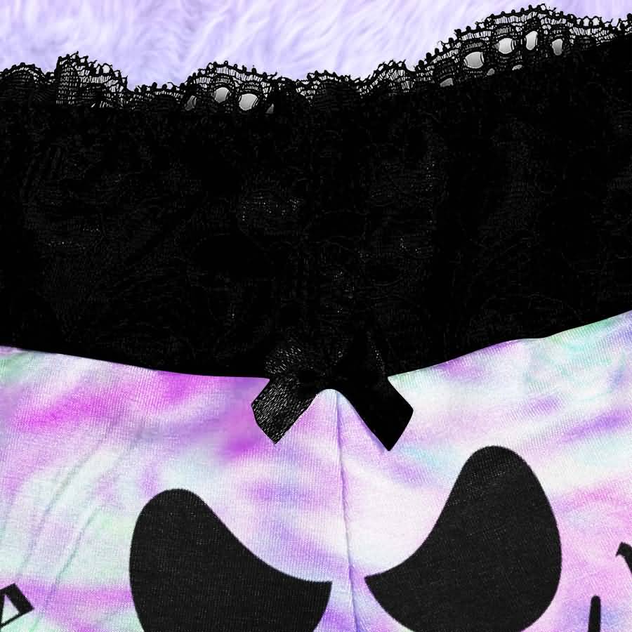 Add a little mischief to your bedtime routine with the Wonder Skull Lace 3-Piece Sleepwear Set. This set includes a lace-trim camisole, matching shorts, and a coordinating thong in a bold green-and-purple graphic print. Delicate black lace adds a feminine touch, while the playful design keeps you feeling comfortable and confident after dark.