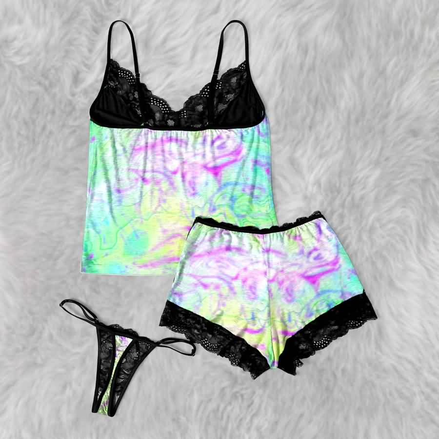 Add a little mischief to your bedtime routine with the Wonder Skull Lace 3-Piece Sleepwear Set. This set includes a lace-trim camisole, matching shorts, and a coordinating thong in a bold green-and-purple graphic print. Delicate black lace adds a feminine touch, while the playful design keeps you feeling comfortable and confident after dark.