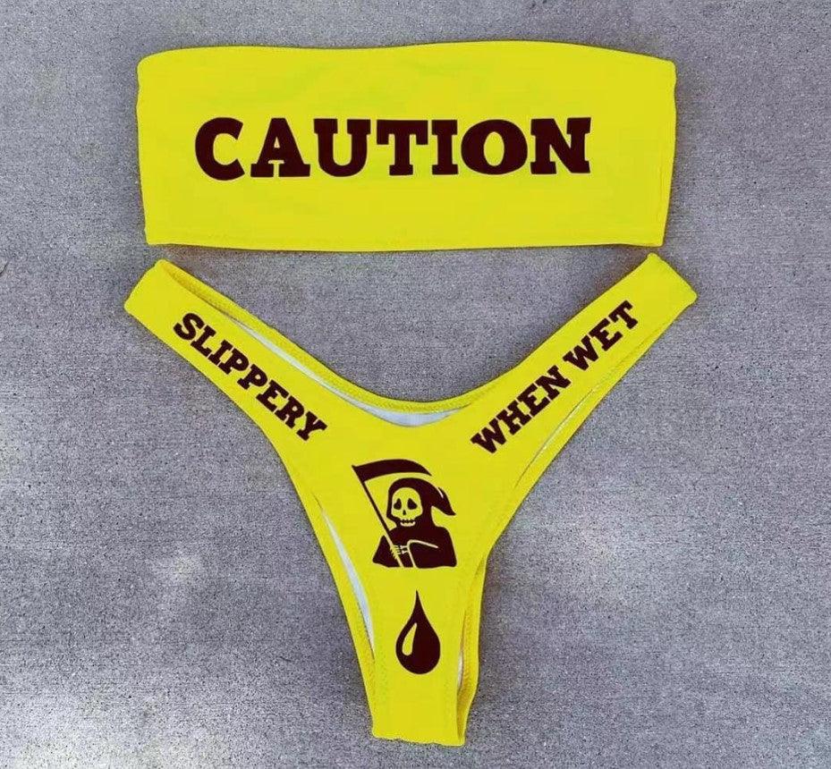Make a splash with the Wonder Skull Neon Yellow Caution Tape Bikini Set. This bold bandeau top features a grippy lining to stay secure, while the stretchy, quick-dry fabric ensures all-day comfort. With daring caution tape and skull graphics, this supportive two-piece set is perfect for making a statement by the pool.