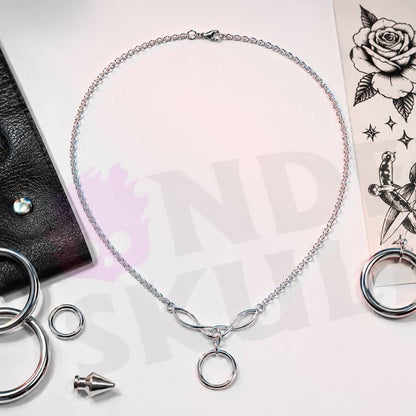 Wonder Skull A dainty stainless steel cable chain leads into an elegant Celtic-style twist link cradling a single polished O-ring — the timeless symbol of D/s devotion. Light, waterproof, and tarnish-resistant, it's built for true 24/7 wear yet discreet enough to pass as everyday jewelry. Unmistakable to the one who knows, invisible to everyone else.