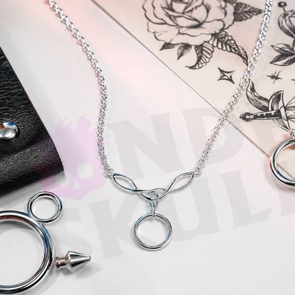 Wonder Skull A dainty stainless steel cable chain leads into an elegant Celtic-style twist link cradling a single polished O-ring — the timeless symbol of D/s devotion. Light, waterproof, and tarnish-resistant, it's built for true 24/7 wear yet discreet enough to pass as everyday jewelry. Unmistakable to the one who knows, invisible to everyone else.