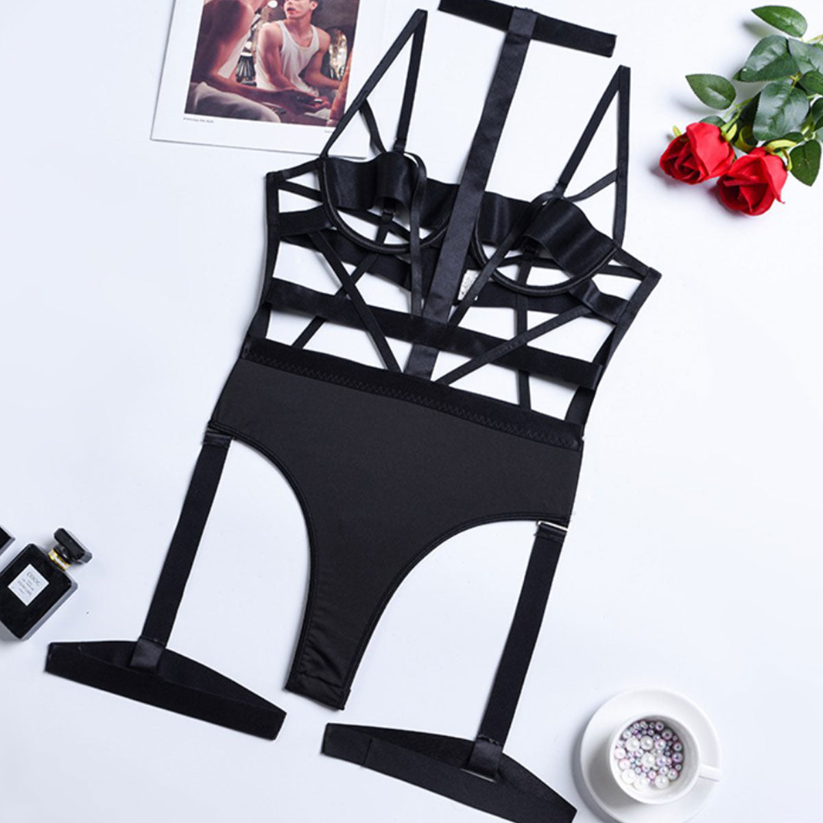 Wonder Skull Obsidian Straps Bondage Bodysuit Lingerie Sleepwear Set combines daring satin straps, a seductive open cup design, and flattering high-cut details to accentuate your curves. Featuring edgy leg harness accents, it’s perfect for making a statement and empowering your confidence. Feel sexy, unstoppable, and ready to own the moment.