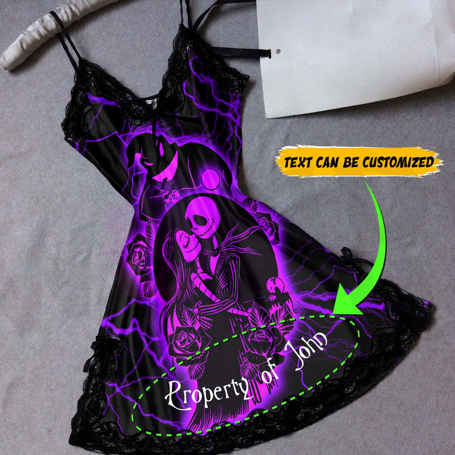 Wonder Skull black satin slip nightgown features bold purple skeleton artwork to liven up your bedtime routine. Buttery-soft satin glides against your skin, with delicate black lace trimming the neckline and hem. Adjustable spaghetti straps ensure a perfect fit, while the flowing A-line silhouette flatters your figure. The purple skeleton couple surrounded by roses makes a bold romantic statement, so you can feel beautifully yourself in your most private moments.