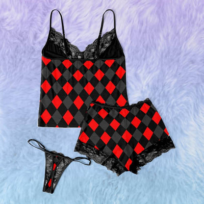 Upgrade your sleepwear with the Wonder Skull Cami Pajama Set. Crafted from silky, breathable fabric, this set keeps you cool and comfortable all night. The soft lace trim adds a feminine touch without irritation, while adjustable spaghetti straps ensure a perfect, custom fit. Finished with a bold graphic print, it’s the perfect blend of personality and comfort for lounging or sleeping.