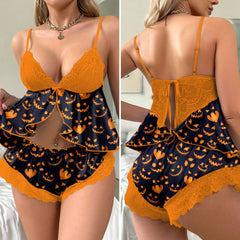 Wonder Skull Smirking Ember Lace Pajama Sleepwear Lingerie Set features a unique ember print on silky black fabric, complemented by vibrant orange lace trim for a touch of gothic glam. The daring open-front babydoll top, fastened with a dainty bow, offers a tantalizing reveal. Crafted from breathable, silky fabric with adjustable straps, this comfortable and stylish set is designed to flatter all body types.