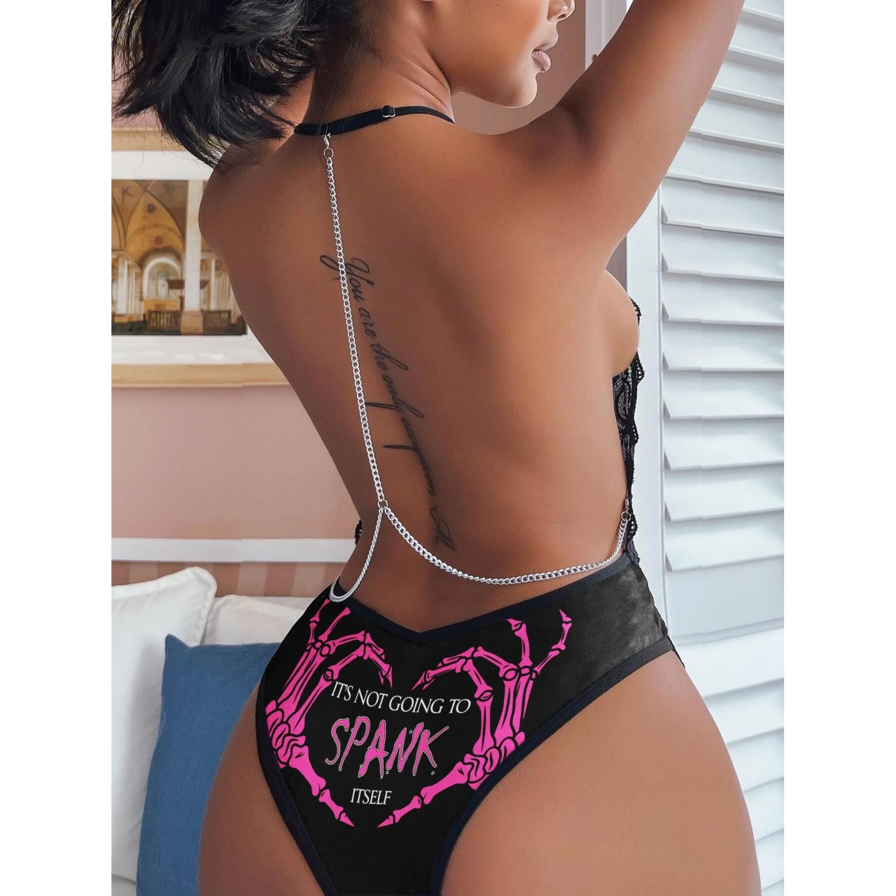 Wonder Skull "Spank It" Naughty Lingerie Backless Bodysuit Halter Teddy Lace Set  is more than just unique lingerie; it's an attitude. Whether you're igniting a spark for a special someone or just spoiling yourself silly, this set is your ticket to feeling like a bold, gothic legend.