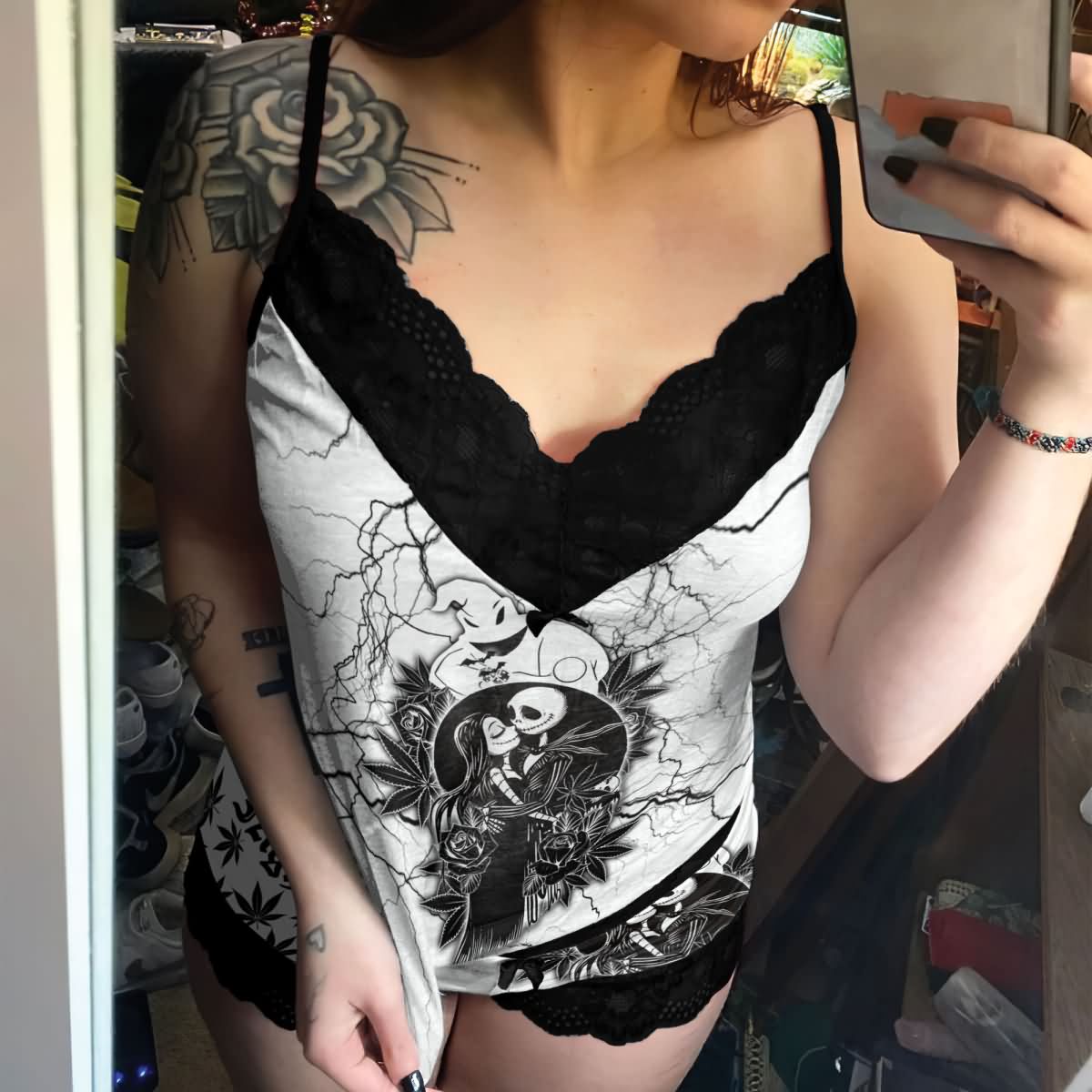 Wonder Skull White Lightning 3-Piece Gothic Sleepwear Set blends edgy design with elegant details. This set includes a white cami adorned with a bold lightning print, Gothic-inspired pajama shorts with stylish lettering, and delicate black lace accents. A coordinating thong completes the look, making it an ideal choice for those who appreciate loungewear that’s equal parts artistic, fashionable, and comfortable.