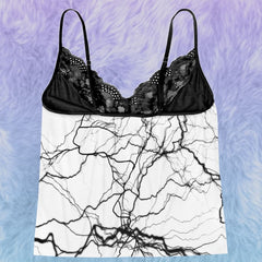 Wonder Skull White Lightning 3-Piece Gothic Sleepwear Set blends edgy design with elegant details. This set includes a white cami adorned with a bold lightning print, Gothic-inspired pajama shorts with stylish lettering, and delicate black lace accents. A coordinating thong completes the look, making it an ideal choice for those who appreciate loungewear that’s equal parts artistic, fashionable, and comfortable.