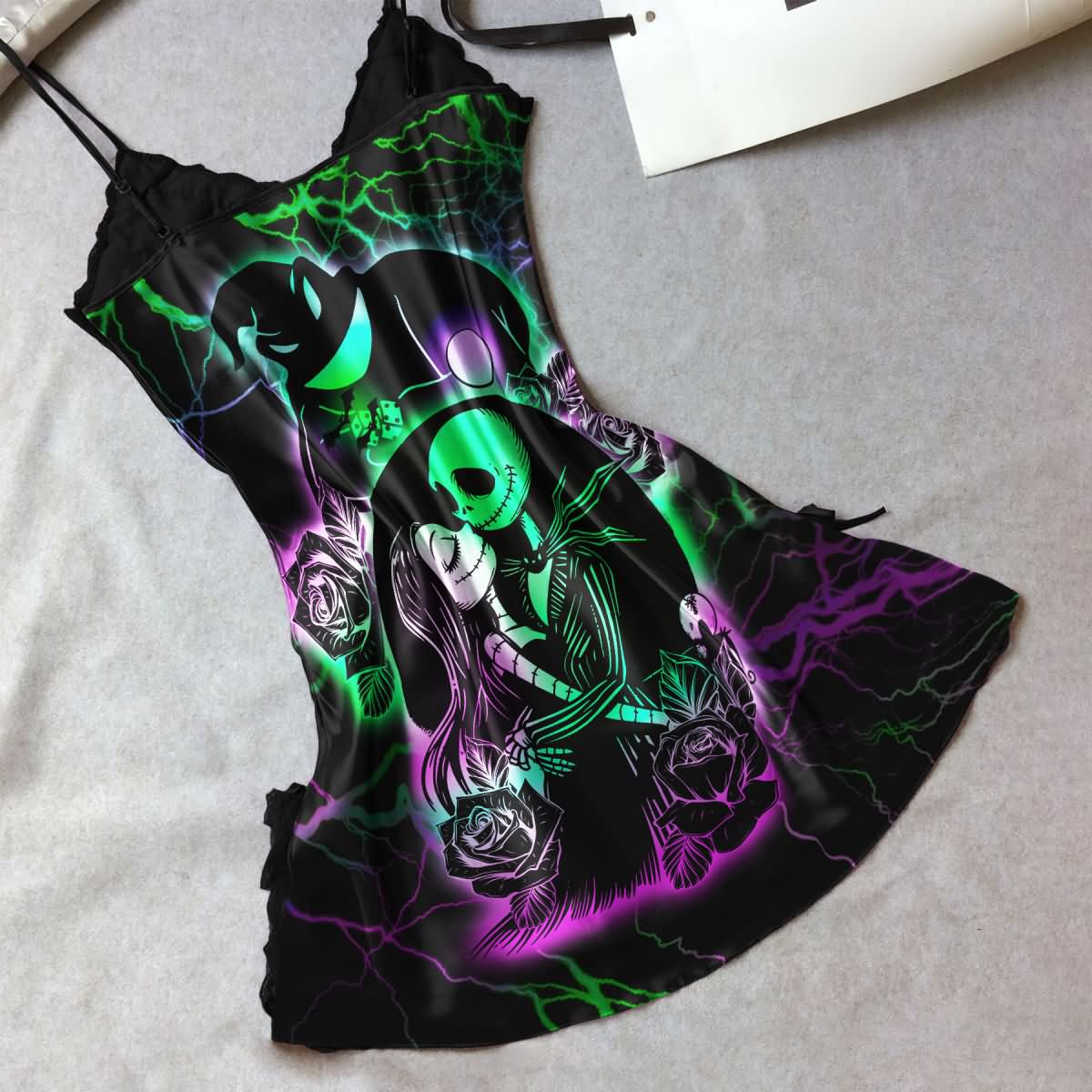 Wonder Skull Women's Black Lace Nightgown. This chic spaghetti strap nightwear babydoll chemise is perfect for special occasions, featuring a unique "Nightmare Before Xmas" design that blends mystery and beauty. Delight your loved ones with this exceptional piece, ideal for anniversaries, birthdays, or just because.